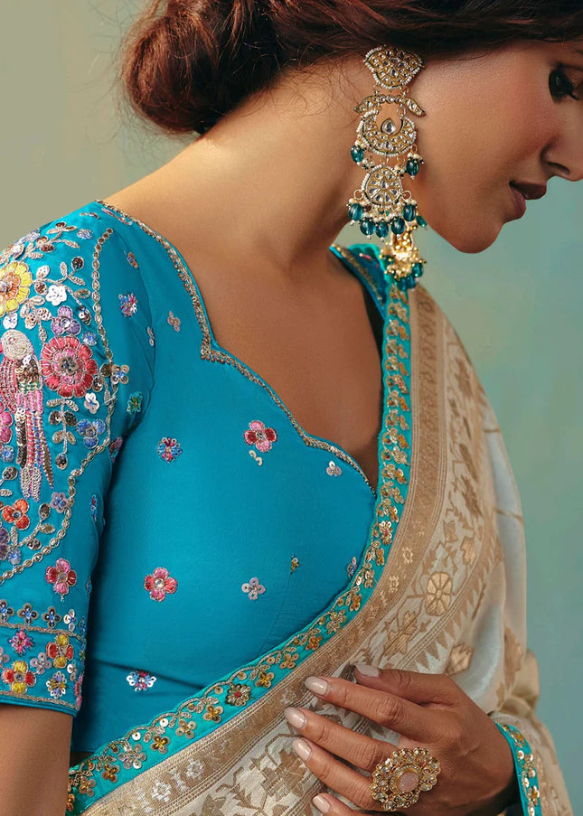 Cream and Blue Embroidered Wedding Saree