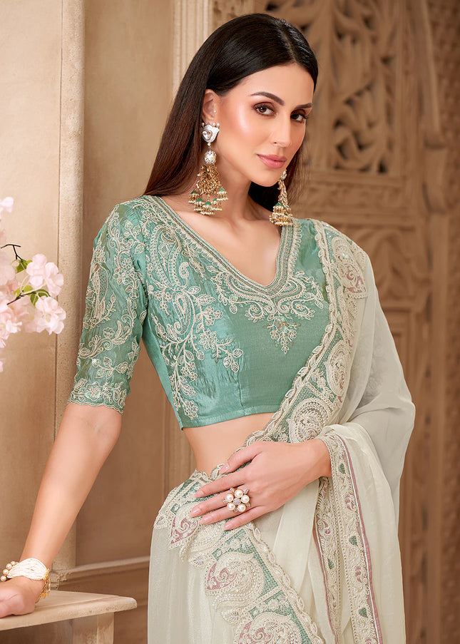 Offwhite and Teal Embroidered Saree